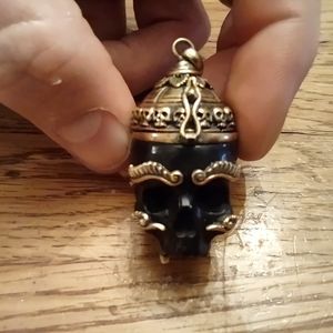 Hand craved secret stash skull pendant